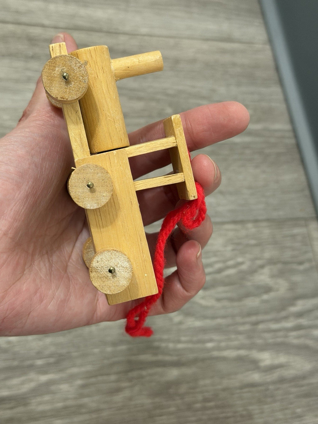 Vint. Wooden Christmas Ornament Unpainted Train Engine W/ Red Yarn Hanging Loop