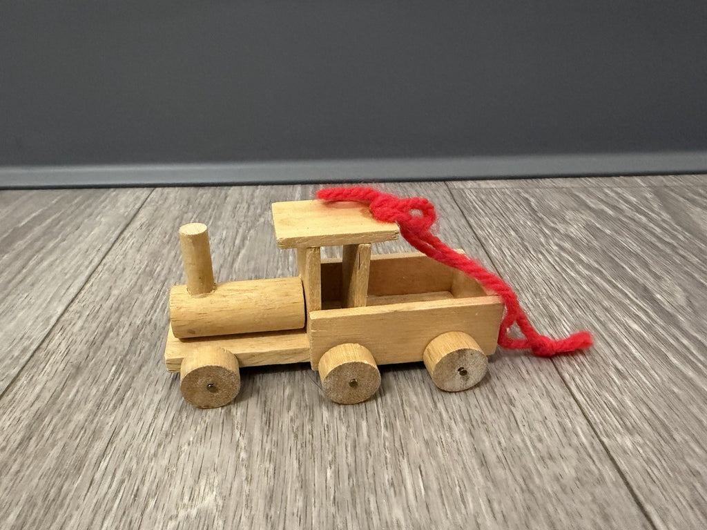Vint. Wooden Christmas Ornament Unpainted Train Engine W/ Red Yarn Hanging Loop