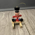 Vintage Tiny Christmas Ornament Boy On A Wooden Sled Handmade Hand Painted