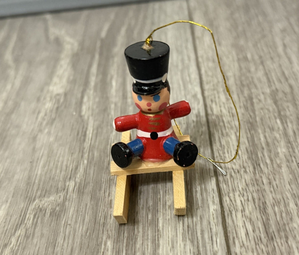 Vintage Tiny Christmas Ornament Boy On A Wooden Sled Handmade Hand Painted