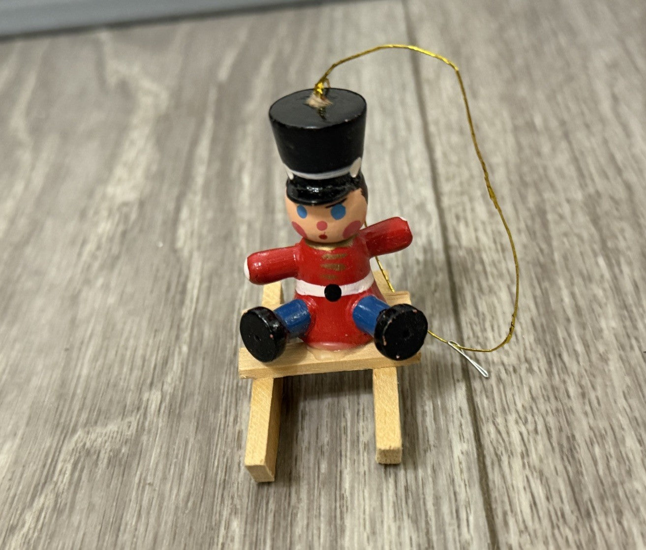 Vintage Tiny Christmas Ornament Boy On A Wooden Sled Handmade Hand Painted