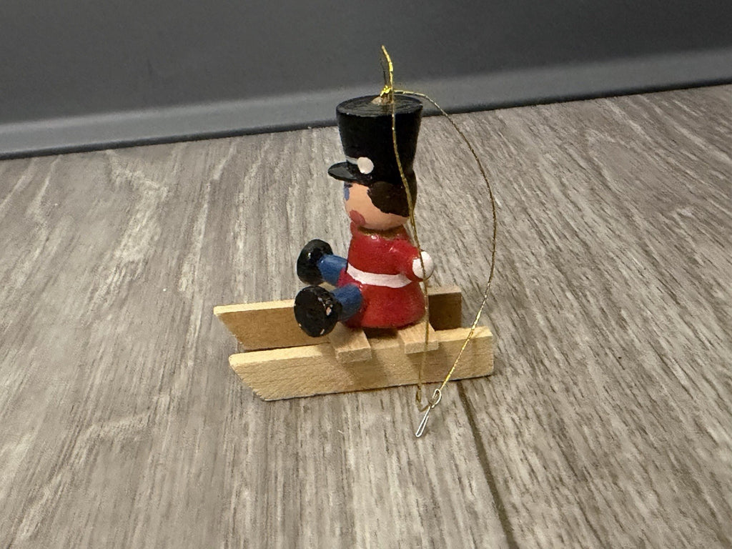 Vintage Tiny Christmas Ornament Boy On A Wooden Sled Handmade Hand Painted