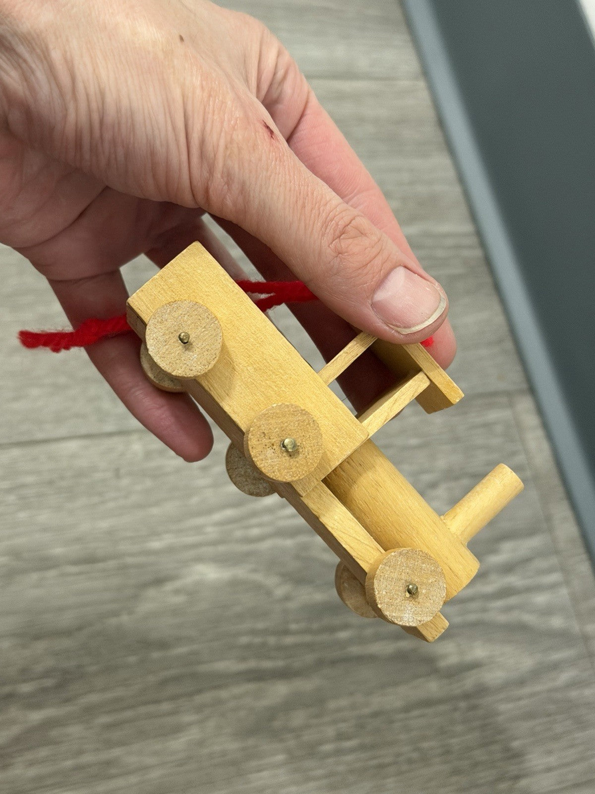 Vint. Wooden Christmas Ornament Unpainted Train Engine W/ Red Yarn Hanging Loop