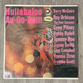 Vinyl record cover with a dancer and text on a wooden surface